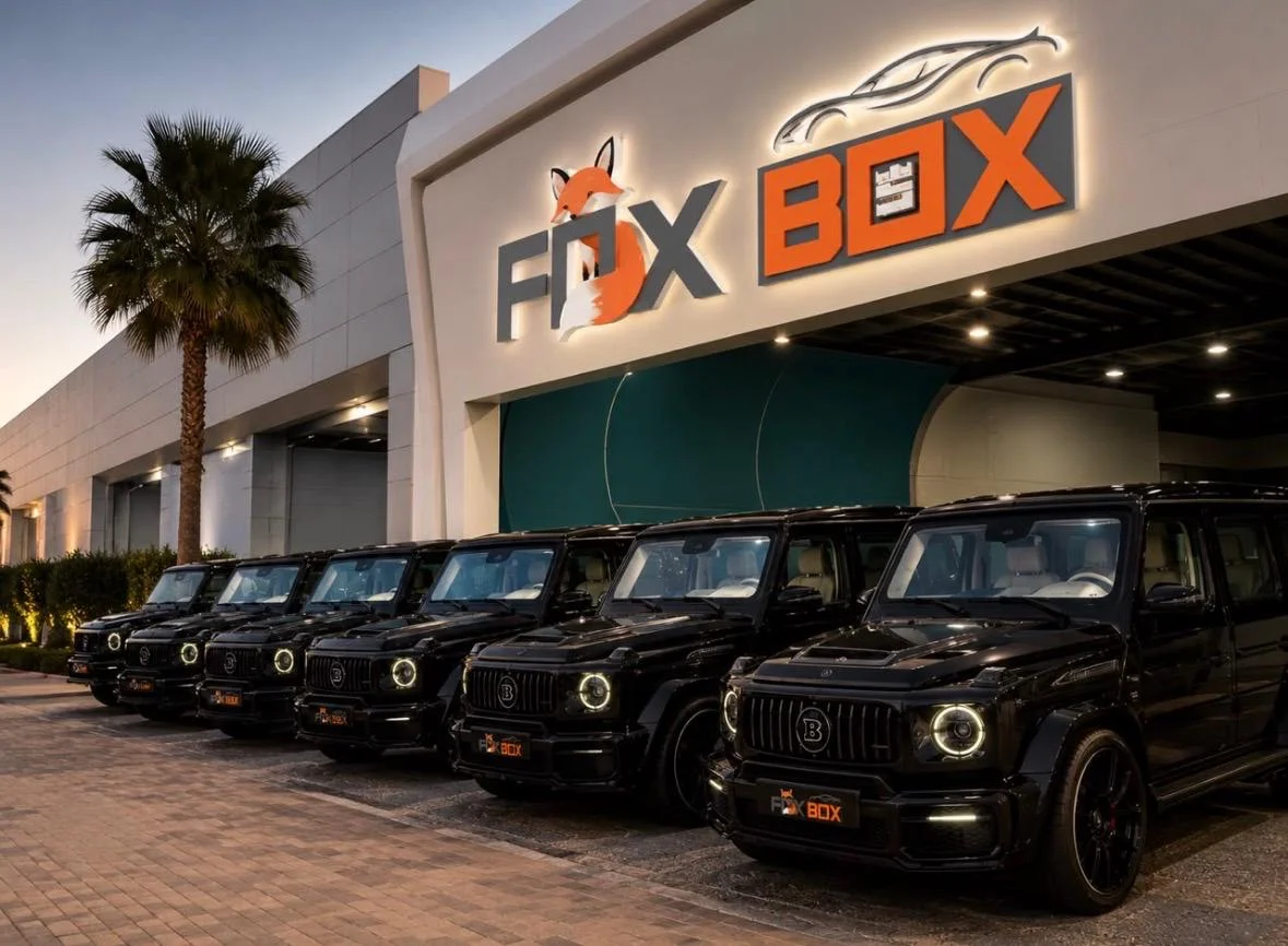 FOXBOX facade with a row of Mercedes G-Class